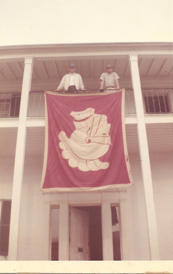 Upsilon brothers displaying a USC banner